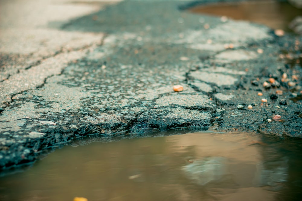 Signs You Need Expert Help for Your Water Damaged Pavement