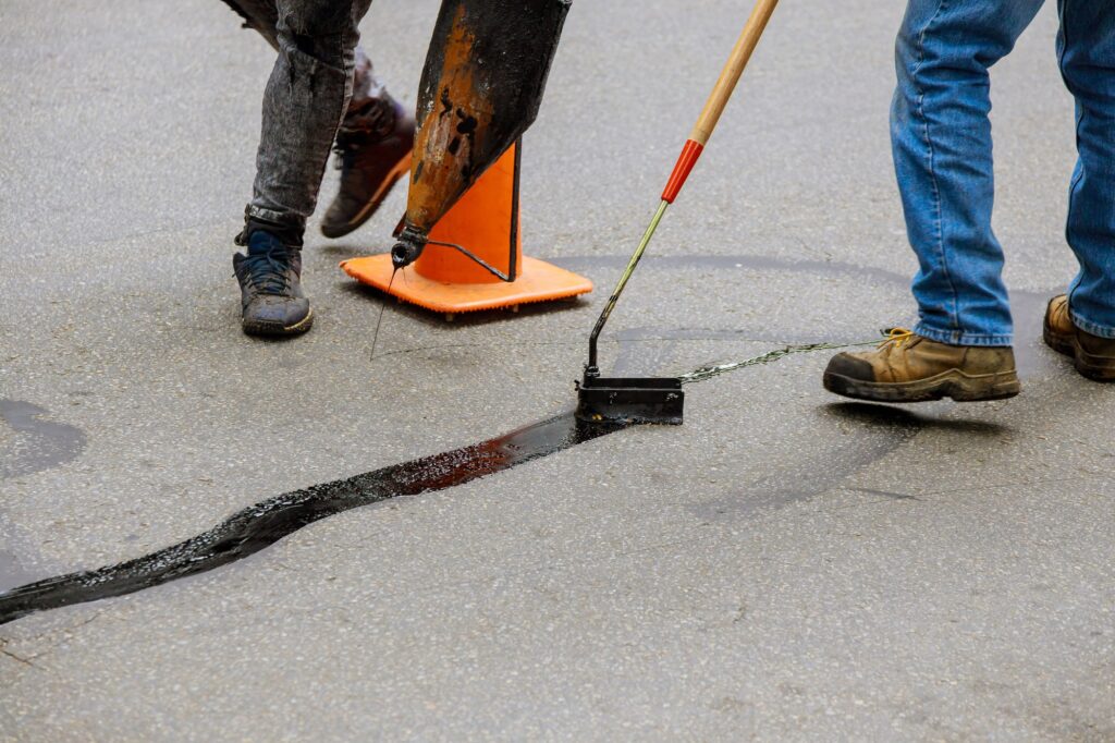 Understanding the Difference Between Crack Fill vs Crack Seal for Asphalt Pavements