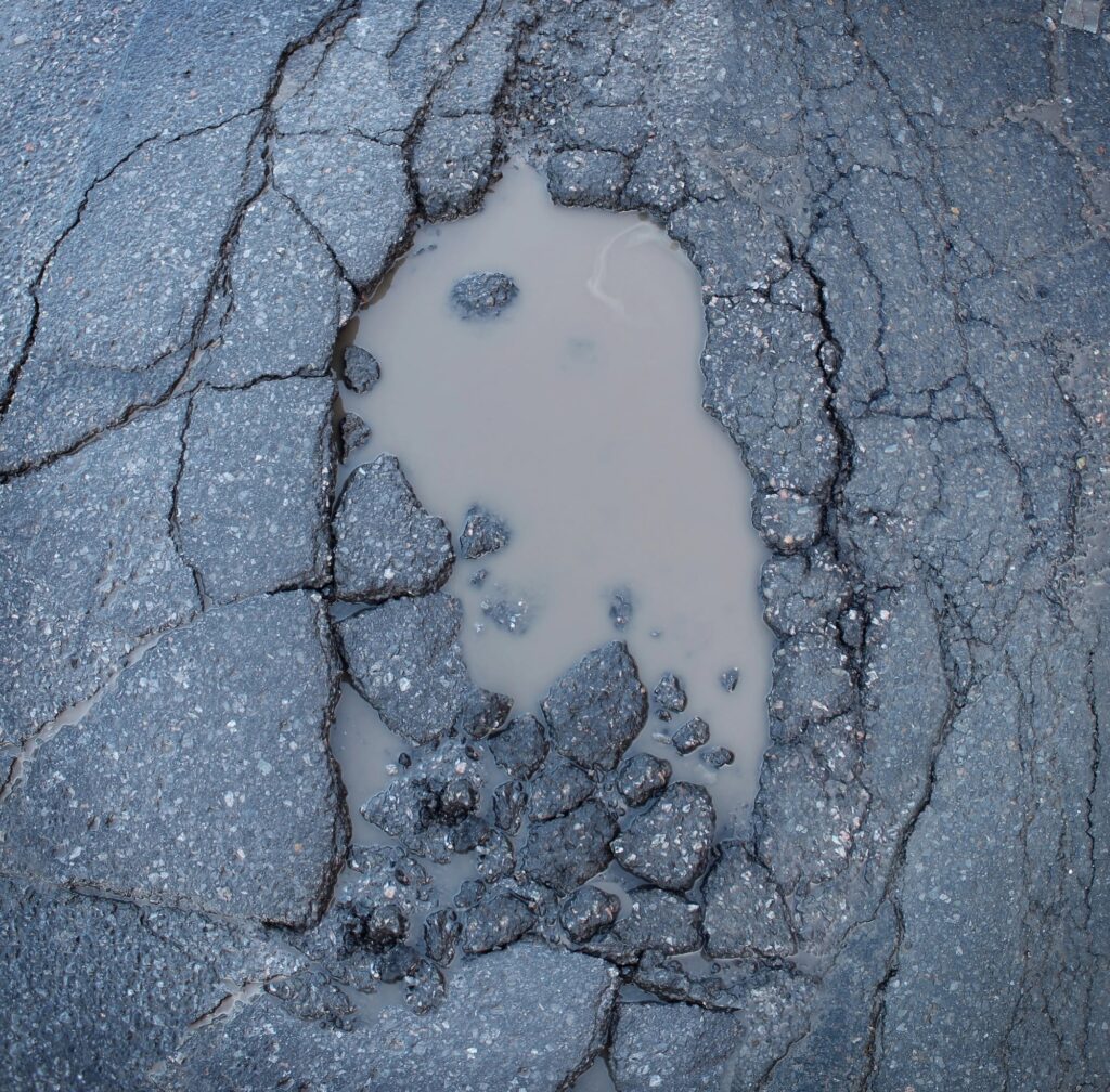 Understanding the Causes and Signs of Water Damaged Pavement