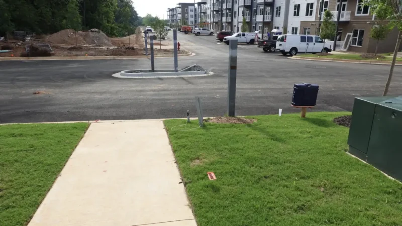 Photo of a parking lot project in process at an apartment complex.