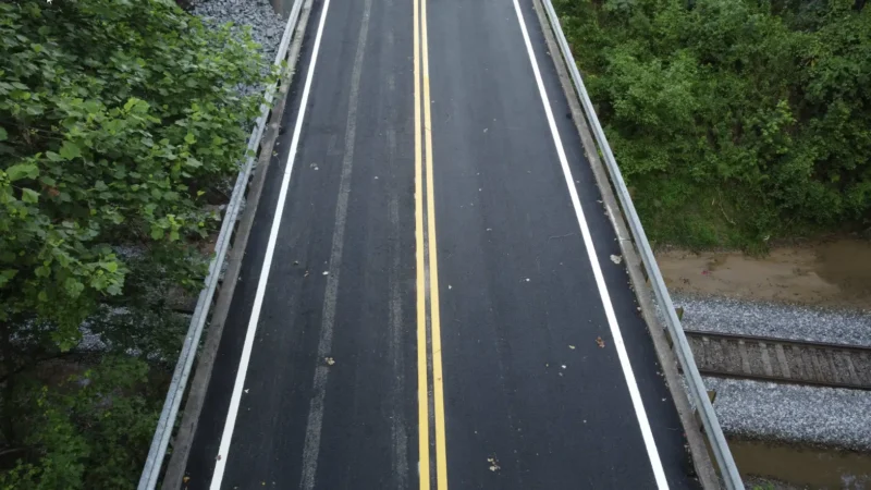 Overhead view of a road with fresh asphalt.