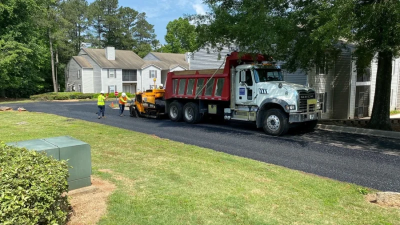 A truck that carries asphalt and GWP workers with tools and machines.